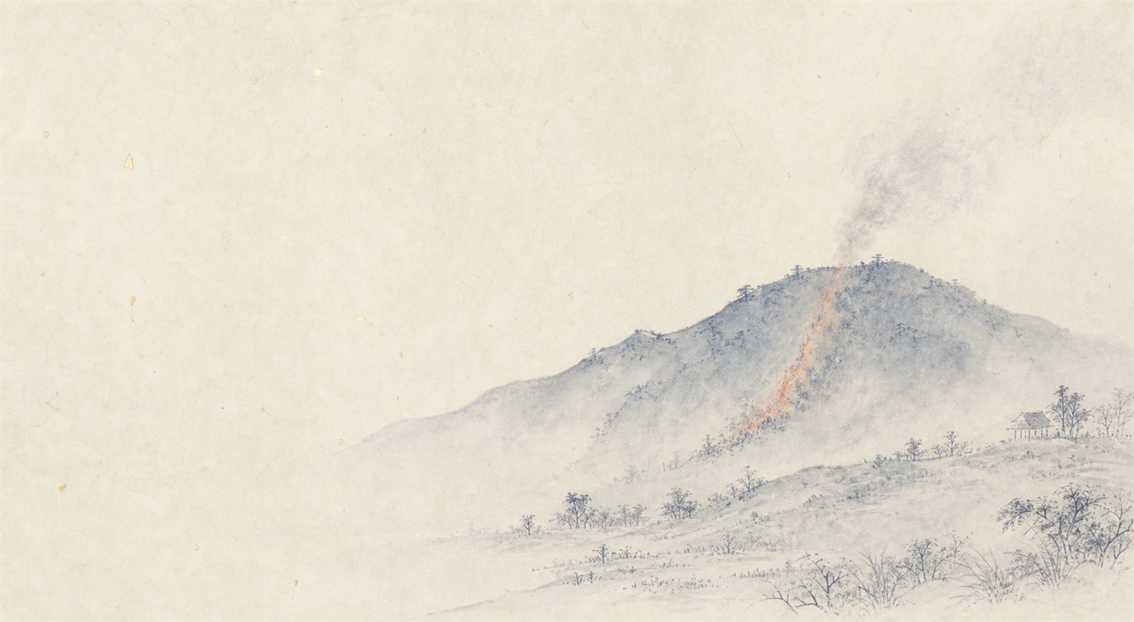 鬼住山の山肌に一筋立ちのぼる朱の炎と煙